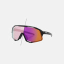 Gafas Velo Store Mx Koo Demos con lente fotocromática Zeiss que muestra el cambio de tono según la luz ambiental.