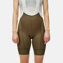 Bib shorts Velo Store Mx Pas Normal Studios Mechanism para dama en color verde oliva con tirantes de malla blanca