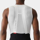 Capa base sin mangas blanca Velocio Ultralight SL de malla técnica para ciclismo, vista trasera sobre ciclista.