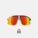 Gafas de ciclismo Velo Store Mx KOO HYPE edición Red Bull BORA-hansgrohe con lente tórica Zeiss roja y montura azul.
