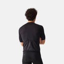 Vista trasera del jersey de ciclismo Velocio ONE negro para hombre, con bolsillos reforzados, disponible en Velo Store Mx