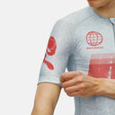 Maillot de ciclismo Pas Normal Studios Mechanism en color Light Aqua con detalles gráficos rojos y ajuste aerodinámico.