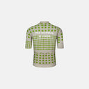 Jersey de ciclismo Velo Store Mx Pas Normal Studios con patrón de puntos verdes sobre fondo hueso, vista trasera.