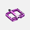 Pedal de MTB Velo Store Mx Deity TMAC morado de aluminio mecanizado con diseño cóncavo y pines de alta tracción