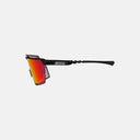 Gafas de ciclismo Velo Store Mx Scicon Aerowatt con lente fotocromática roja y montura negra, vista lateral.